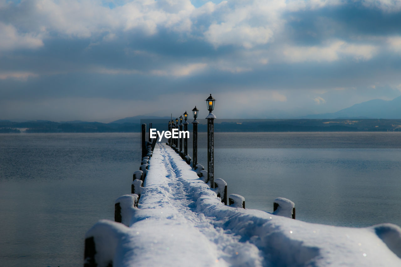 Scenic view of sea against sky during winter