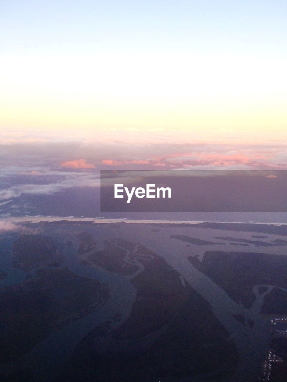 Aerial view of landscape against clear sky during sunset