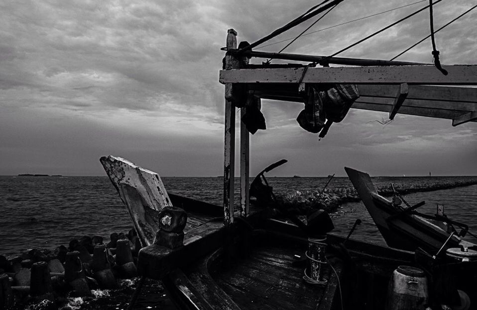 VIEW OF SEA AGAINST CLOUDY SKY