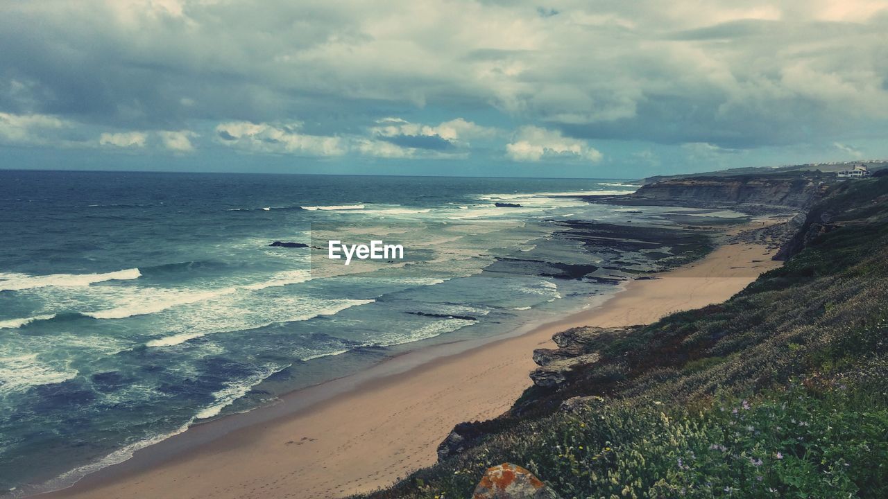 Scenic view of beach against sky