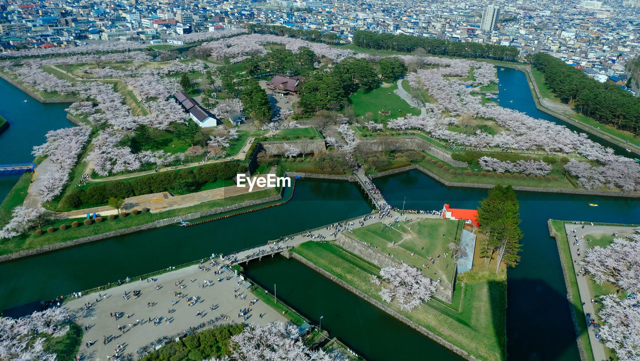 High angle view of river amidst buildings in city