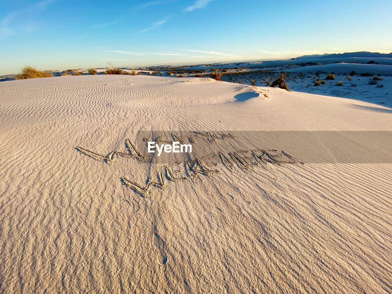 FOOTPRINTS ON SAND AT BEACH