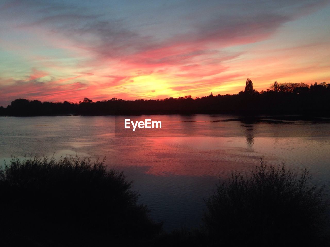 SUNSET OVER LAKE