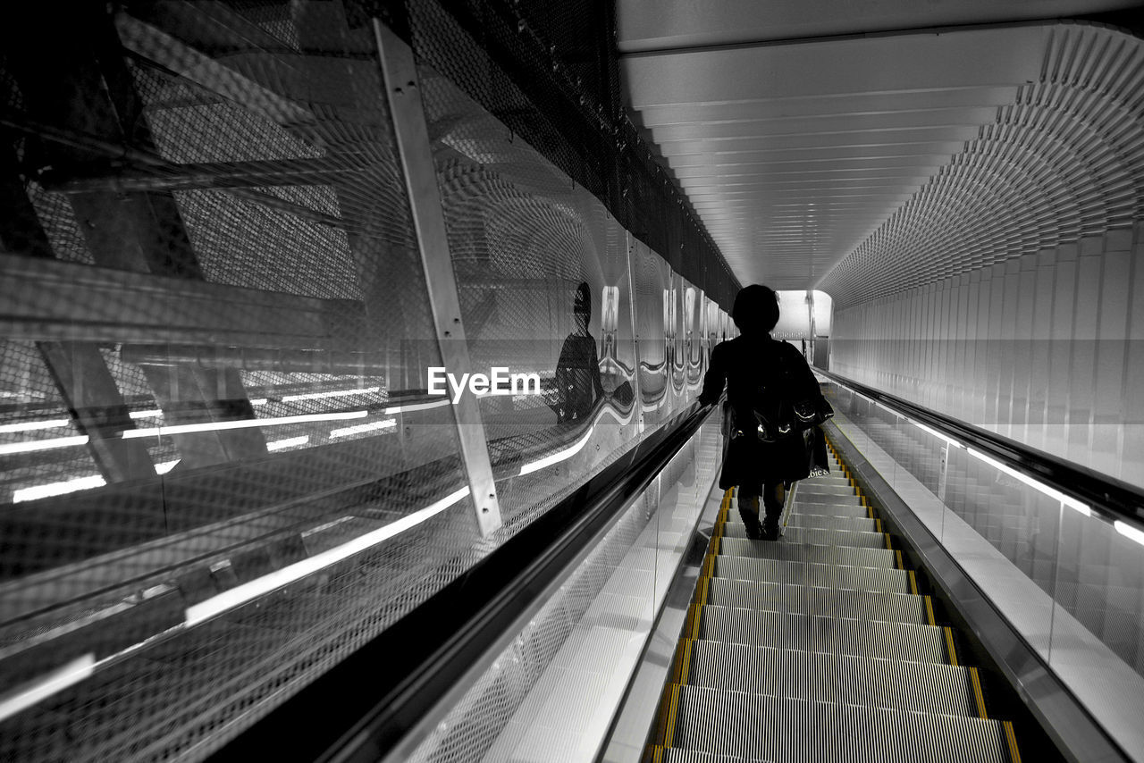 High angle view of person on escalator