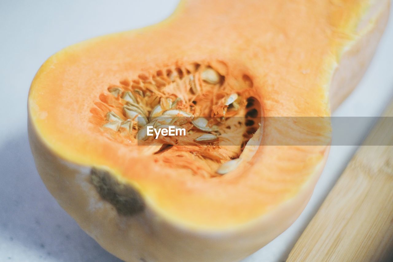 food and drink, food, plant, pumpkin, healthy eating, produce, vegetable, wellbeing, freshness, fruit, cross section, winter squash, squash, slice, cantaloupe, indoors, close-up, no people, galia, seed, halved, studio shot, orange color, honeydew