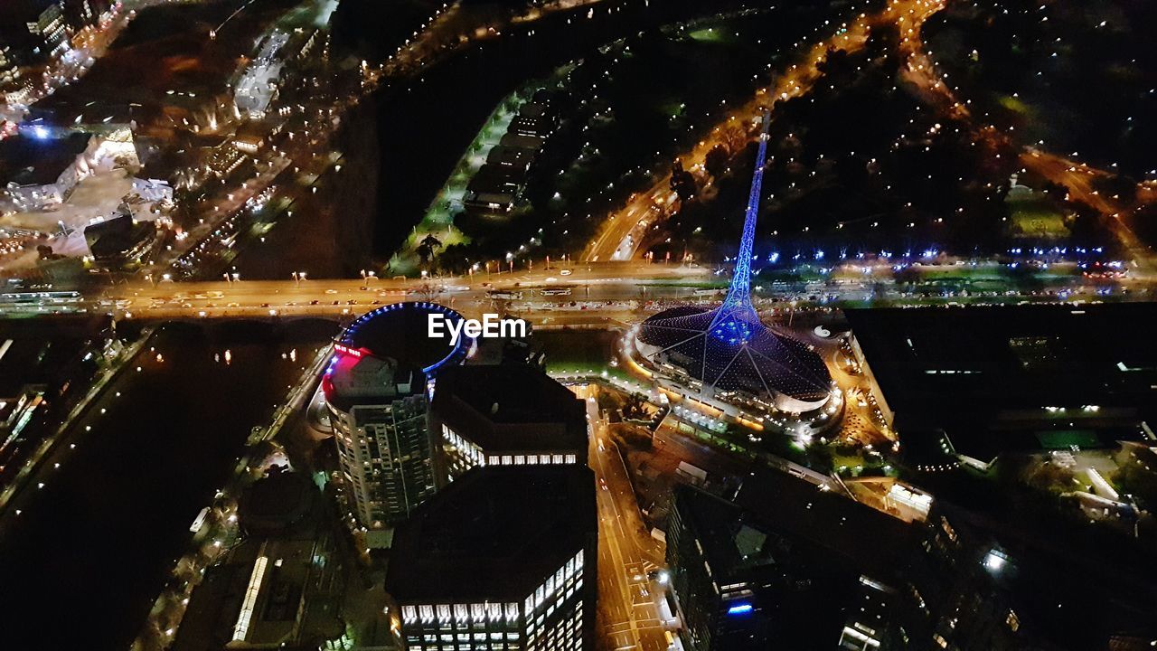 Aerial view of illuminated city at night