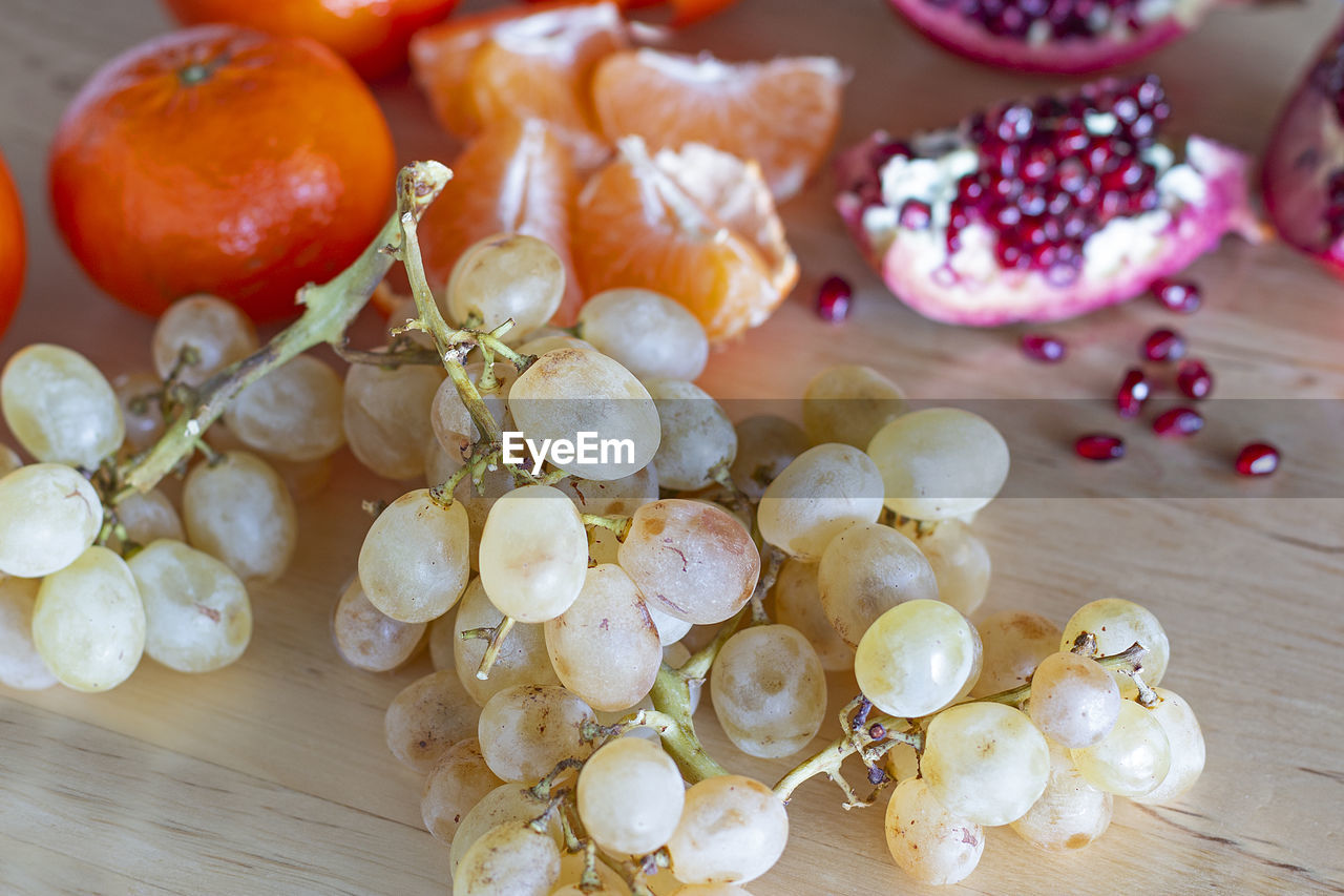 HIGH ANGLE VIEW OF FRUITS IN CONTAINER ON TABLE