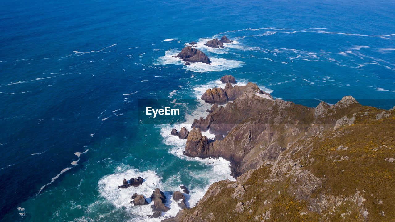 High angle view of rock formation in sea