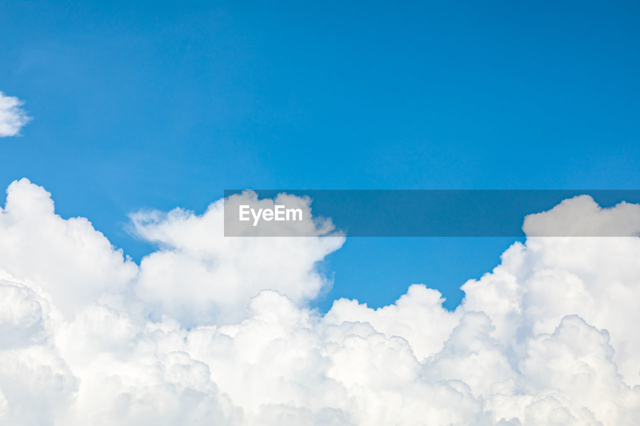 Blue sky as background, white clouds with blue background on a sunny day, and a clear sky.