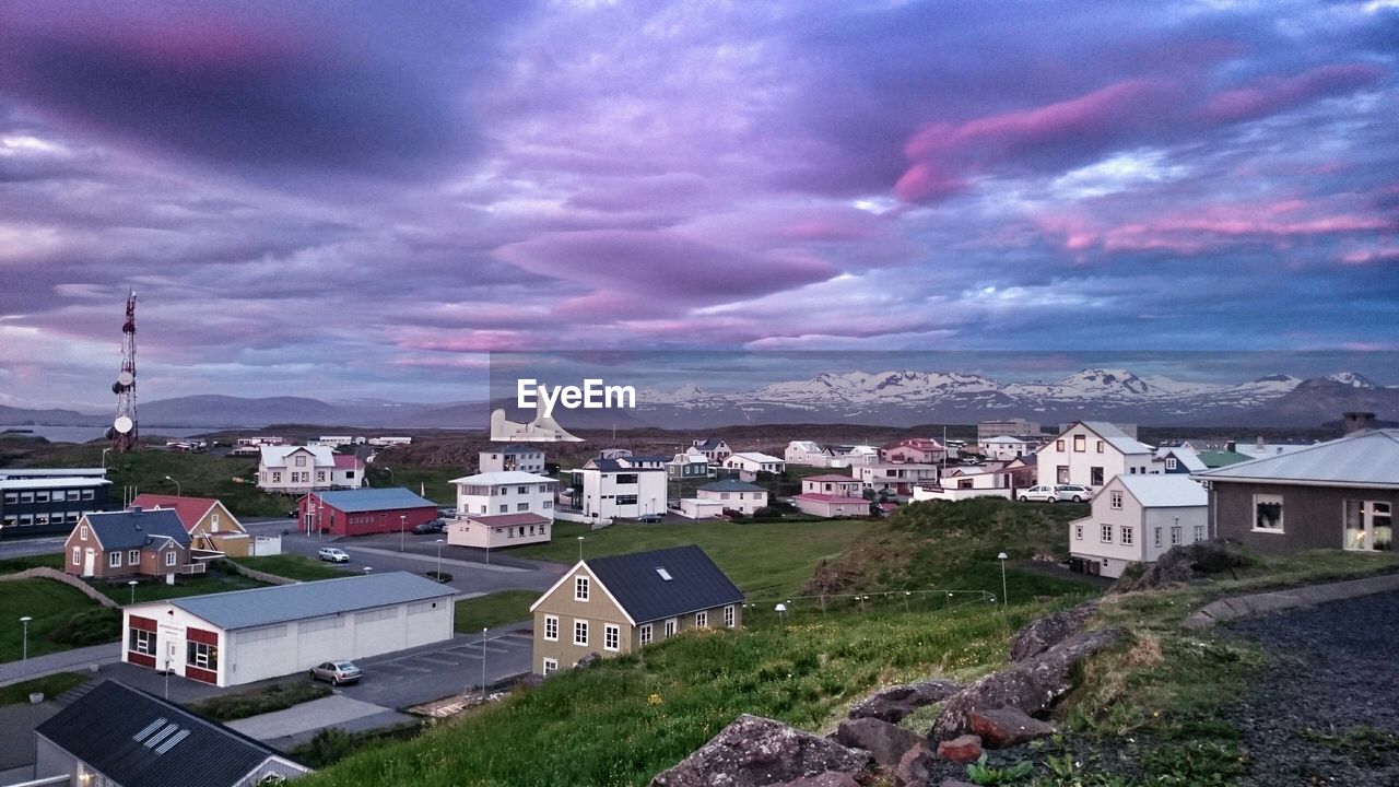 High angle view of city against dramatic sky