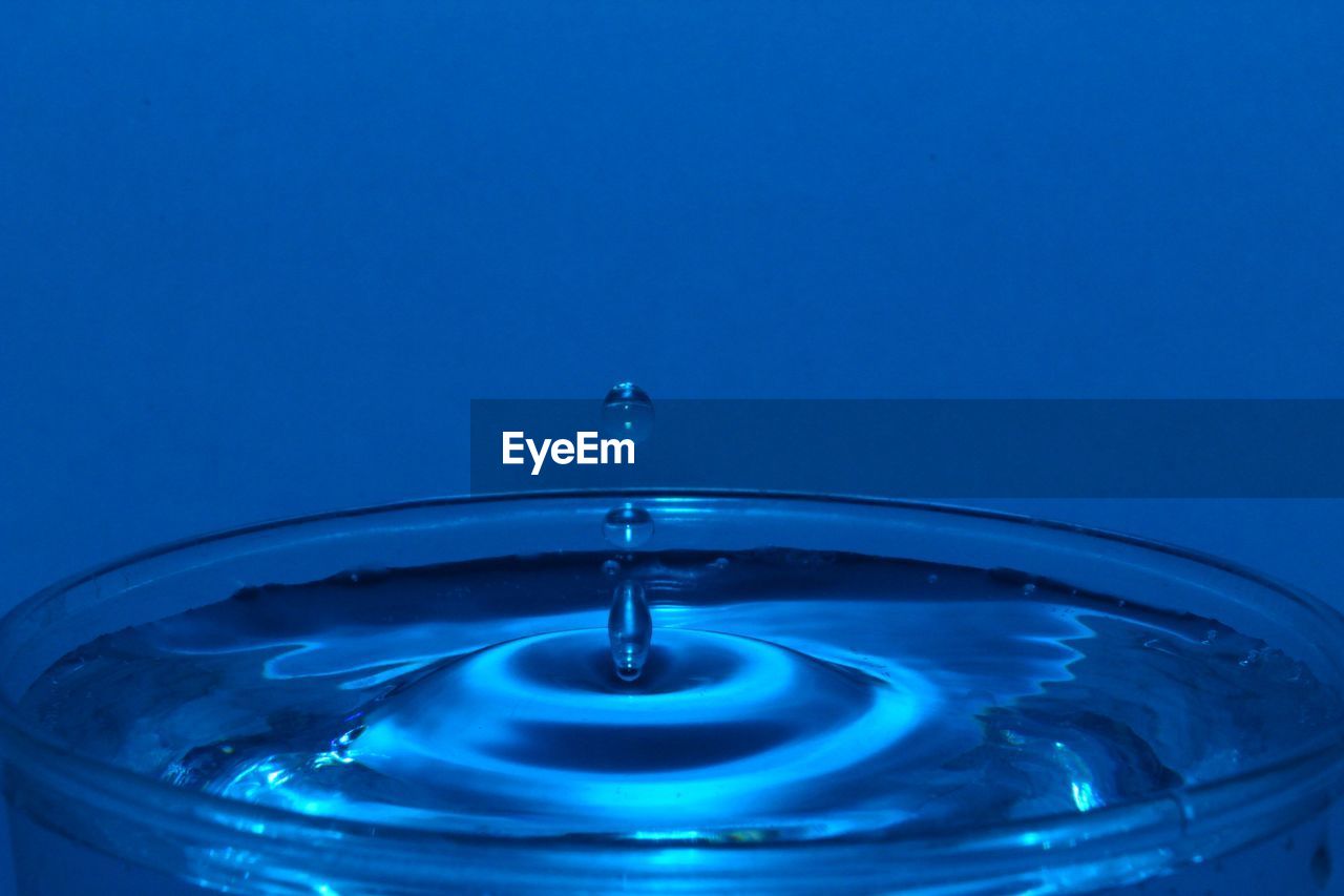 Close-up of drop falling in water