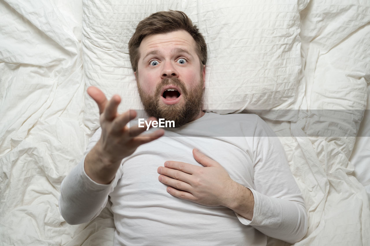 high angle view of woman sleeping on bed at home