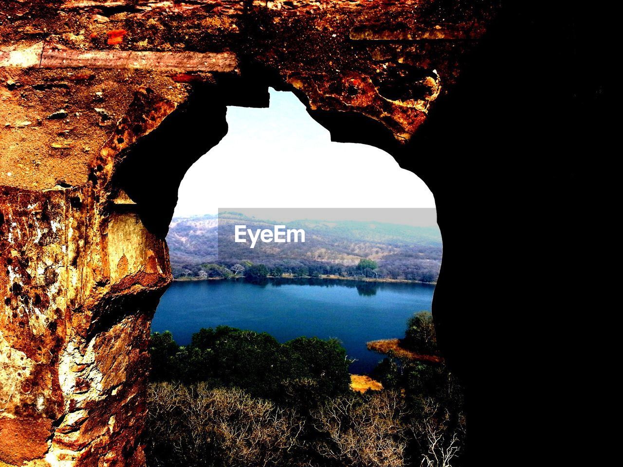 Lake viewed through arch