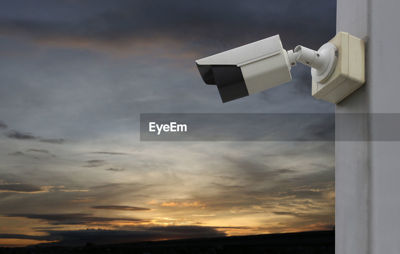 Cctv tool on twilight sky background,equipment for security systems and have copy space for design.