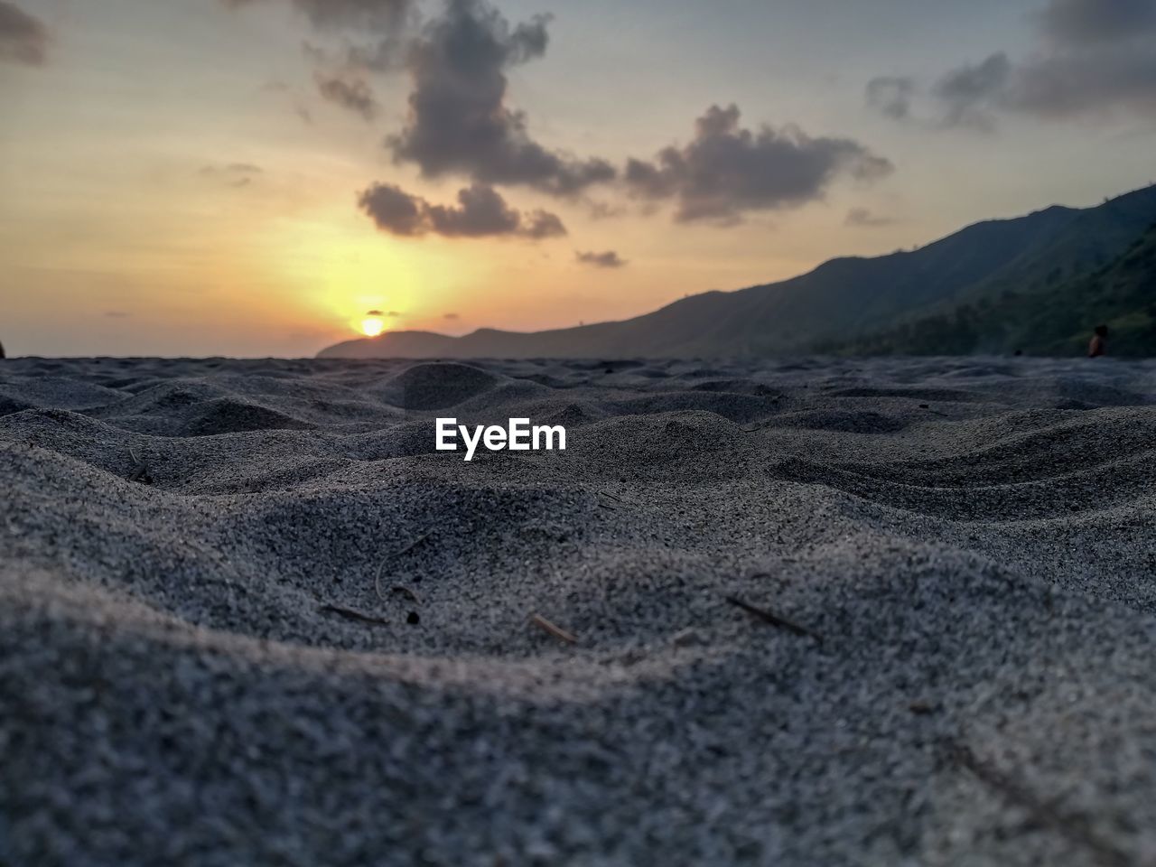 Scenic view of beach against sky during sunset