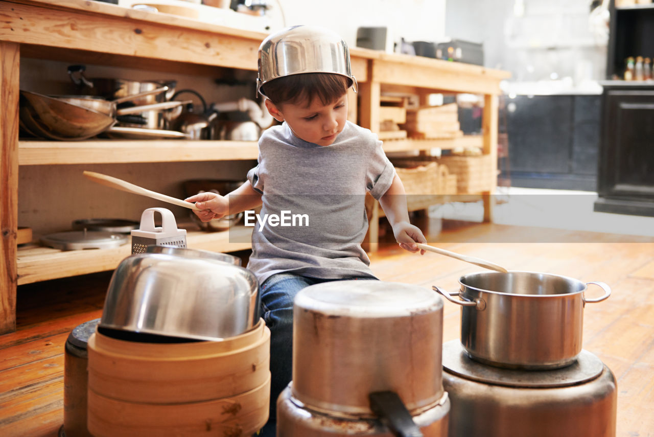 Portrait of boy standing in workshop