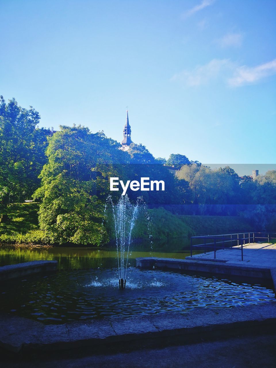 RIVER AMIDST TREES AGAINST SKY