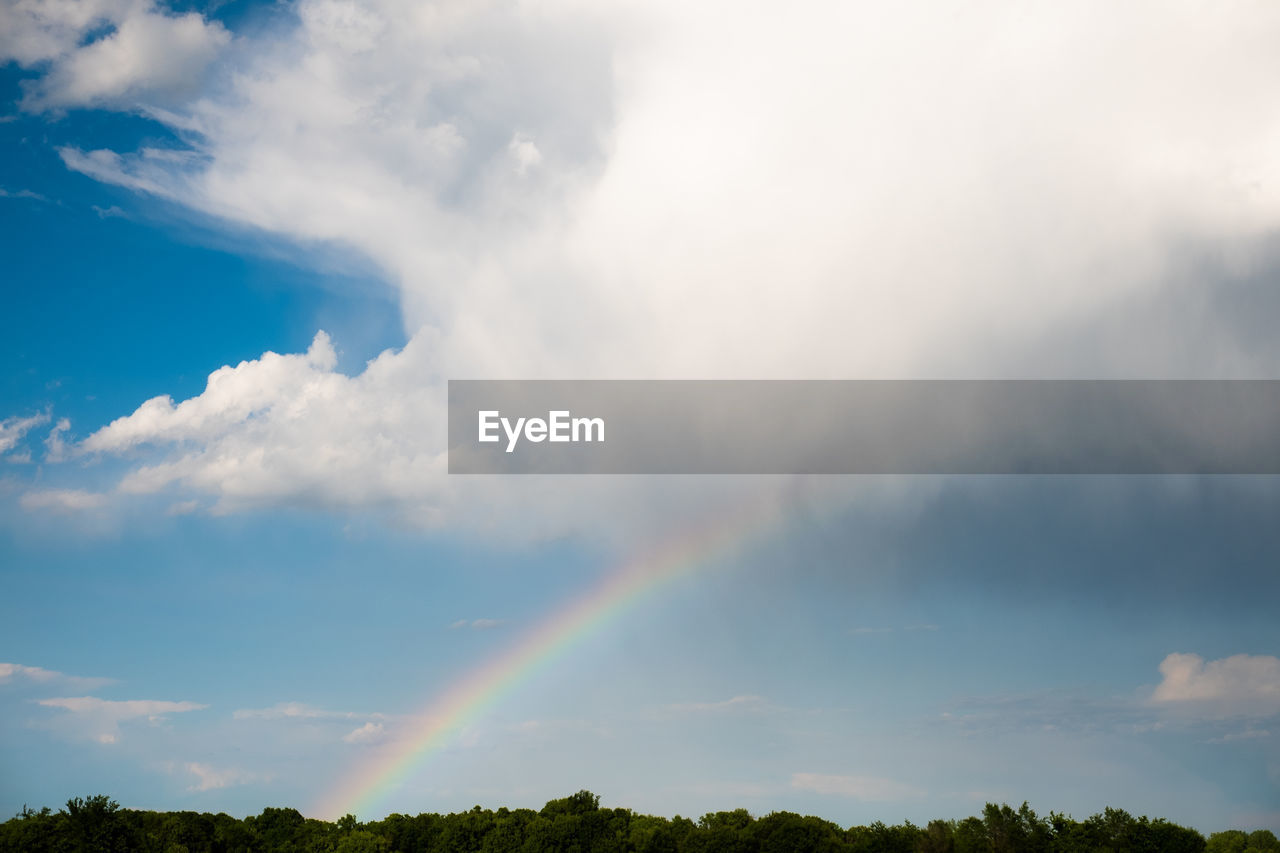 Low angle view of rainbow against sky