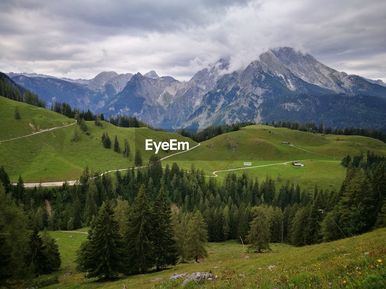 Scenic view of landscape and mountains against sky