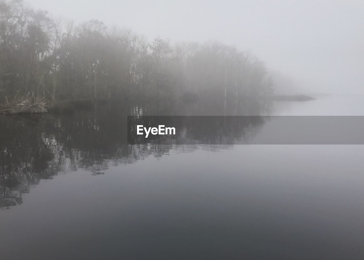 SCENIC VIEW OF LAKE IN FOGGY WEATHER