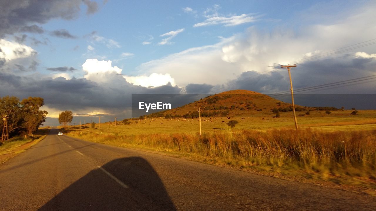 COUNTRY ROAD PASSING THROUGH LANDSCAPE