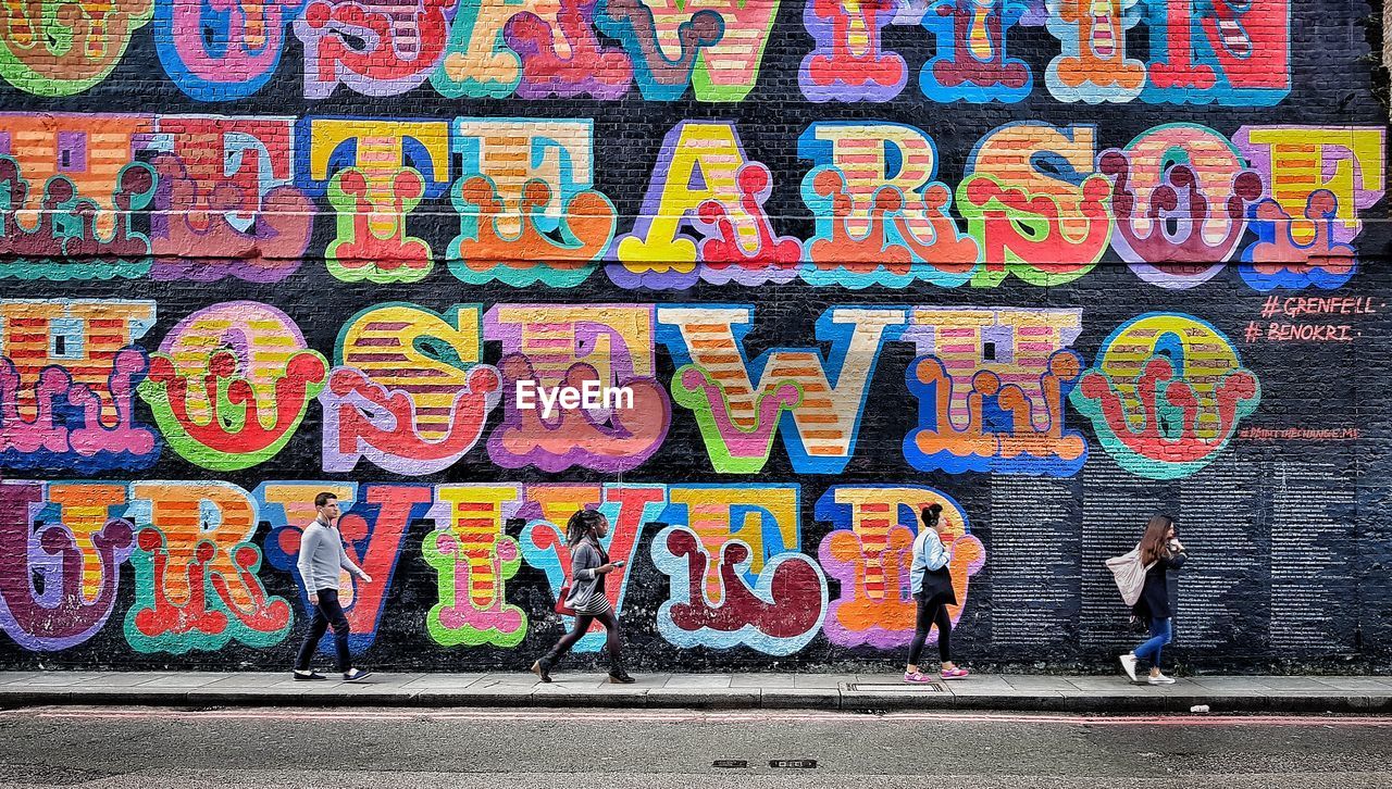 GRAFFITI ON WALL IN CITY