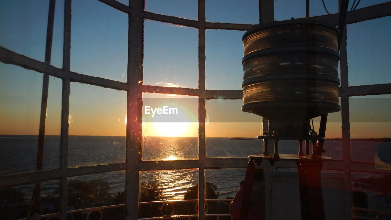 SCENIC VIEW OF SEA AGAINST SKY AT SUNSET