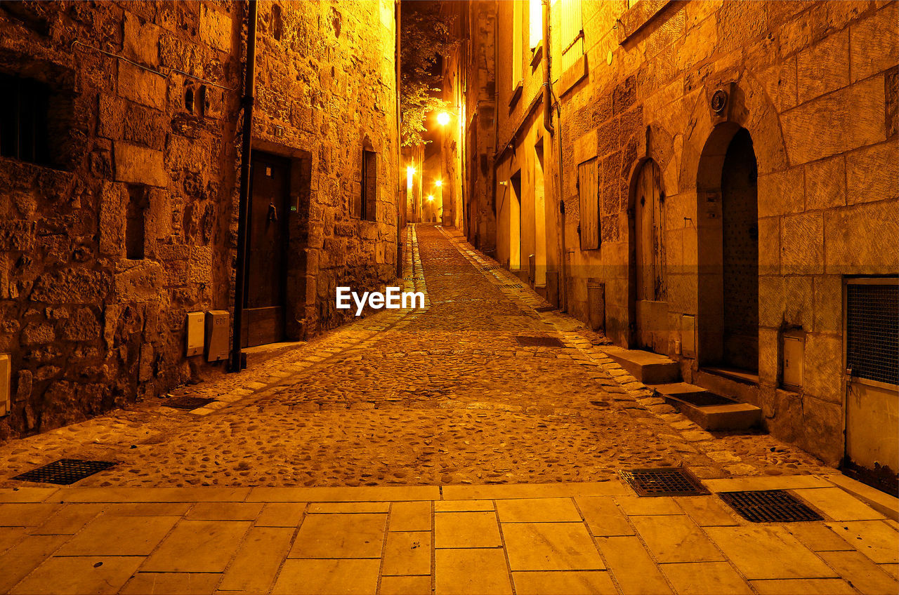 NARROW ALLEY ALONG OLD BUILDINGS