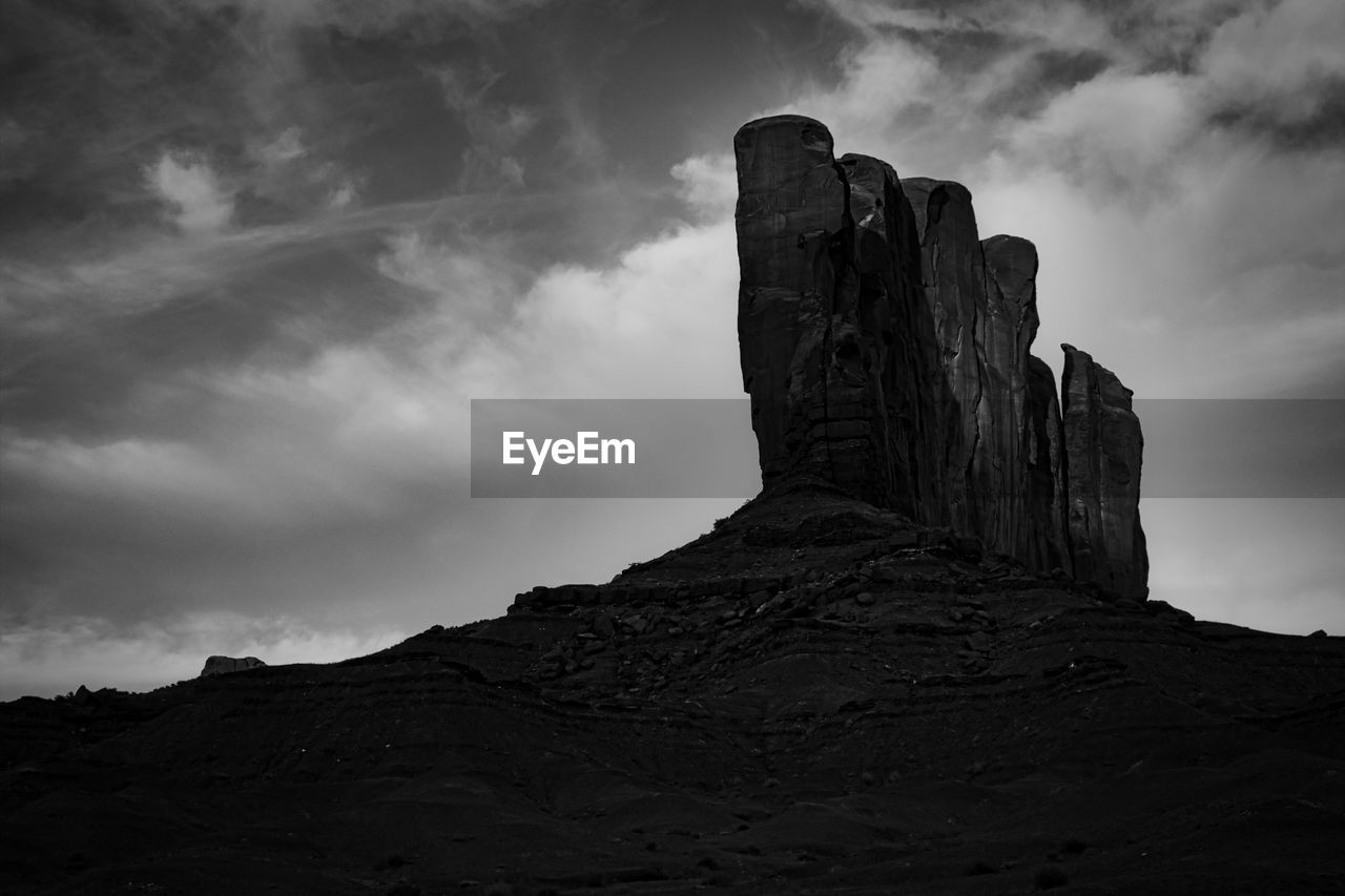 Low angle view of rock formation against sky