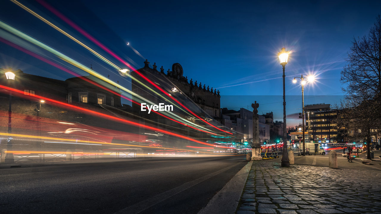 Light trails on road in city at night