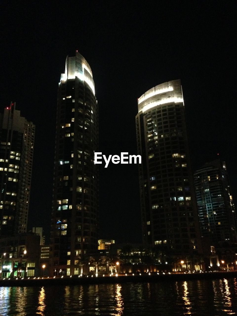 ILLUMINATED CITYSCAPE AT NIGHT