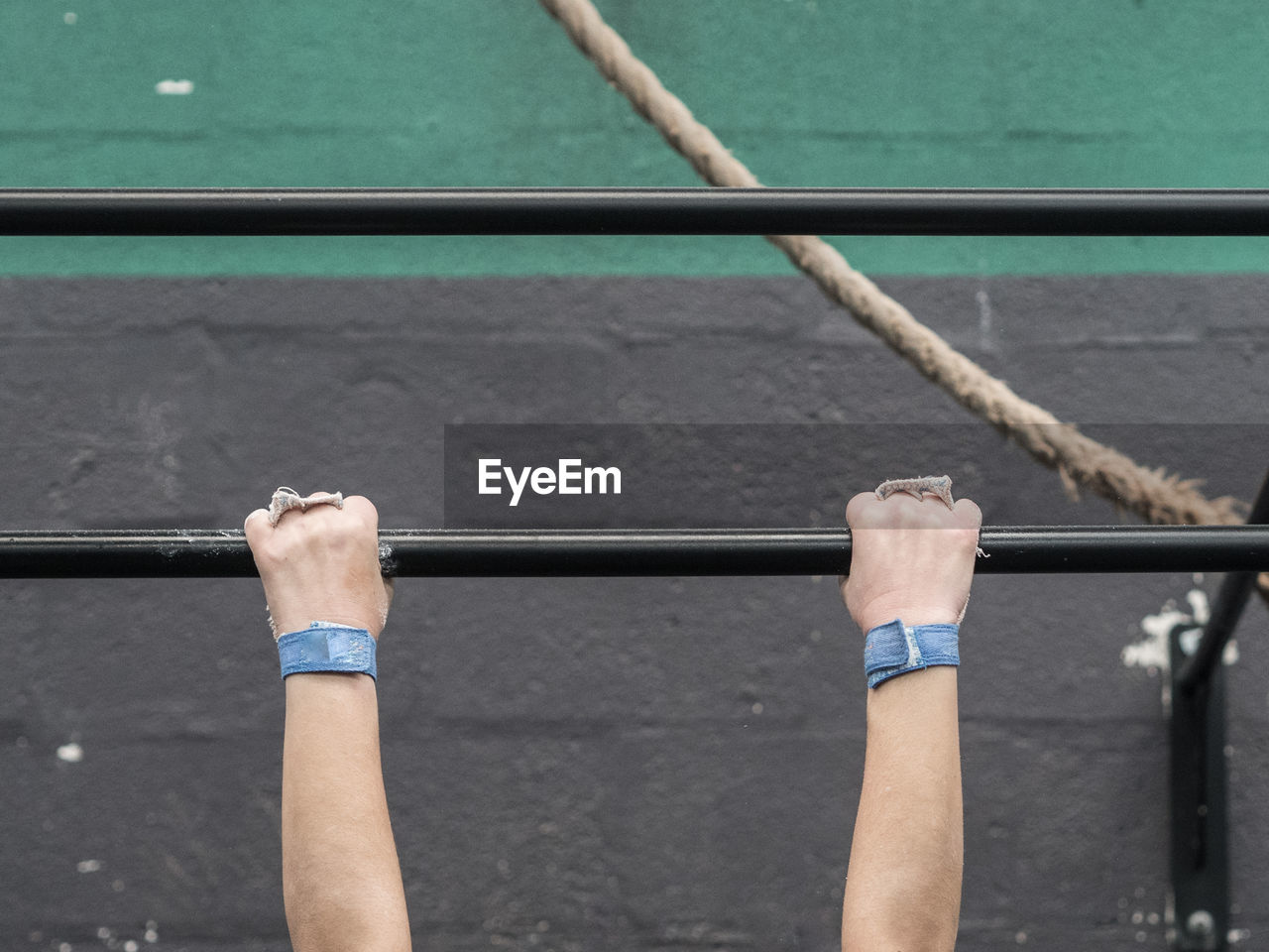 Low angle view of man holding rod