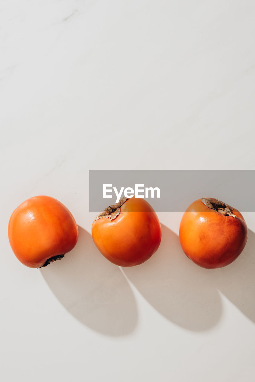 high angle view of tomatoes on white background