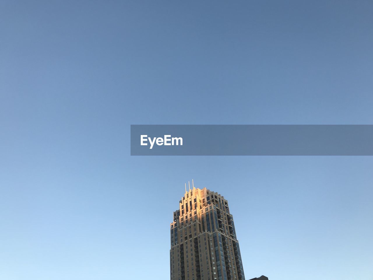 Low angle view of buildings against blue sky