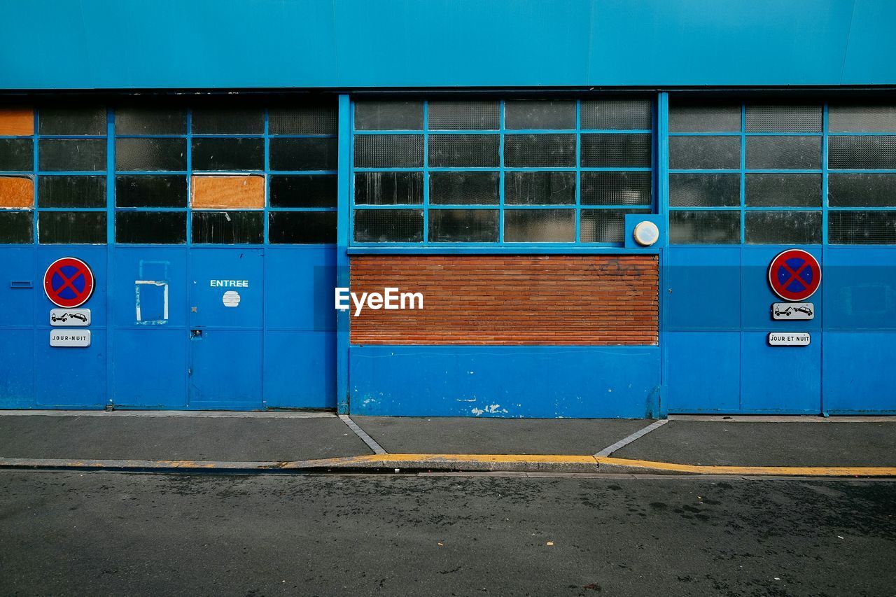 Signs on blue building