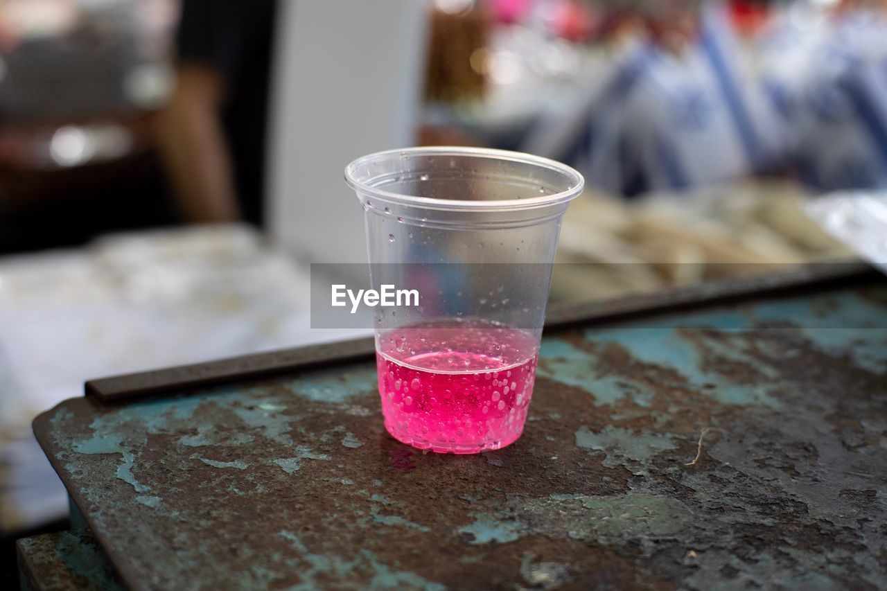 CLOSE-UP OF DRINK ON TABLE