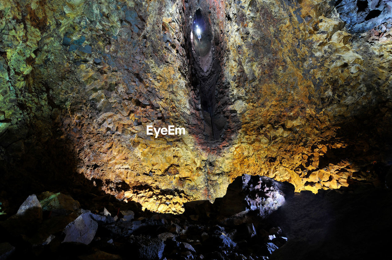 Low angle view of rock formation at night