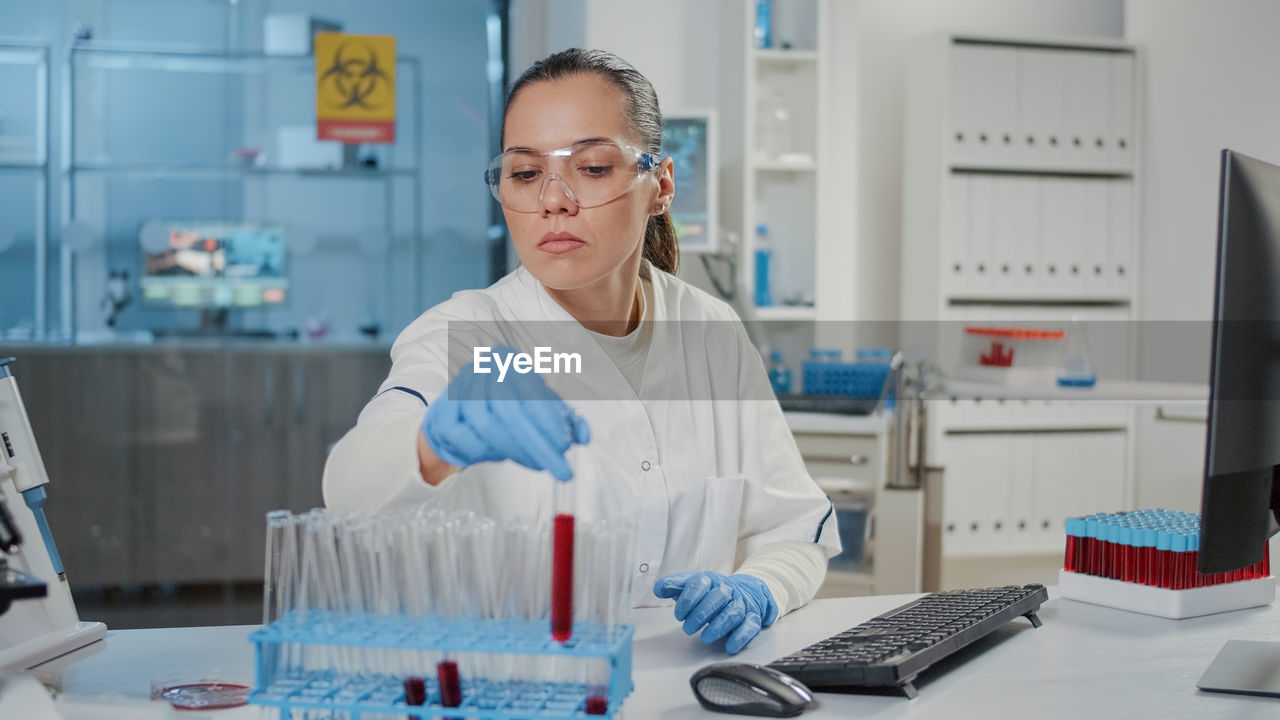 Young scientist experimenting at lab