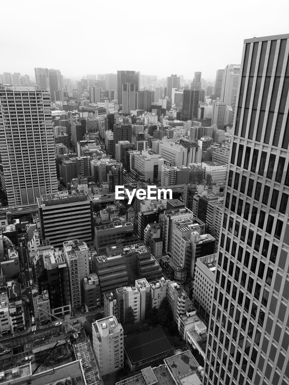 High angle view of buildings in city against sky