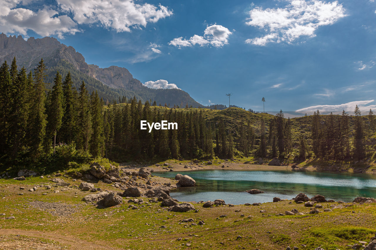 Lake carezza is a small alpine lake in the dolomites, italy.