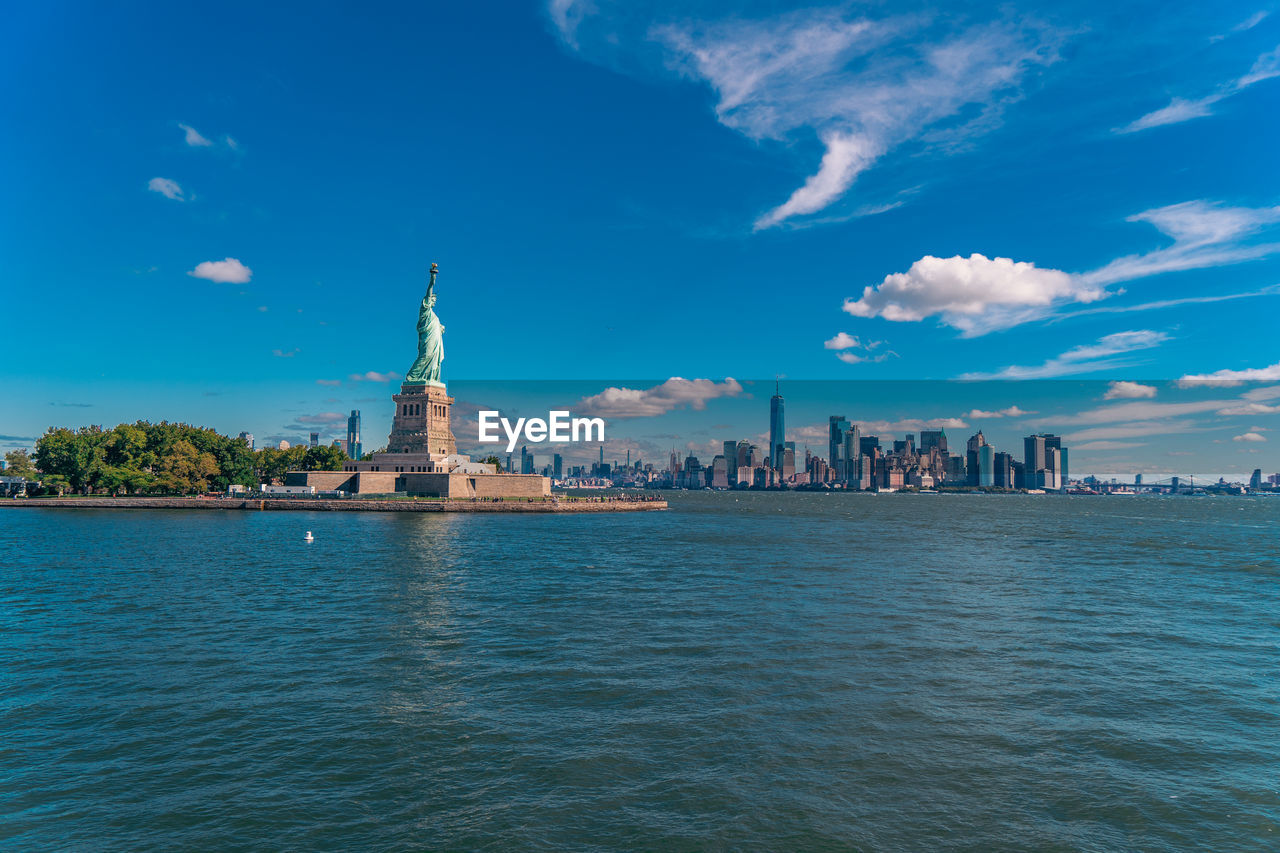 Statue of liberty with the skyline in the background