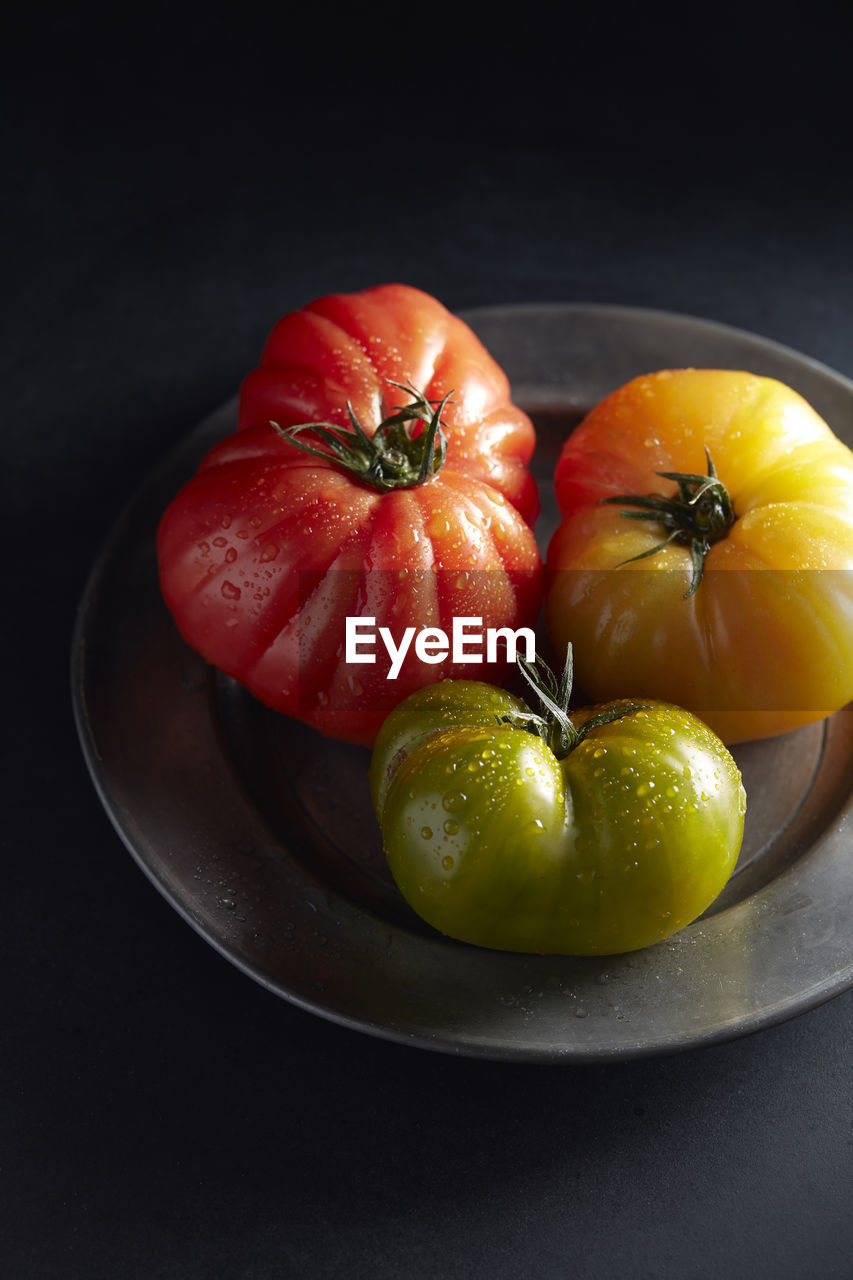 Heirloom tomatoes on pewter plate