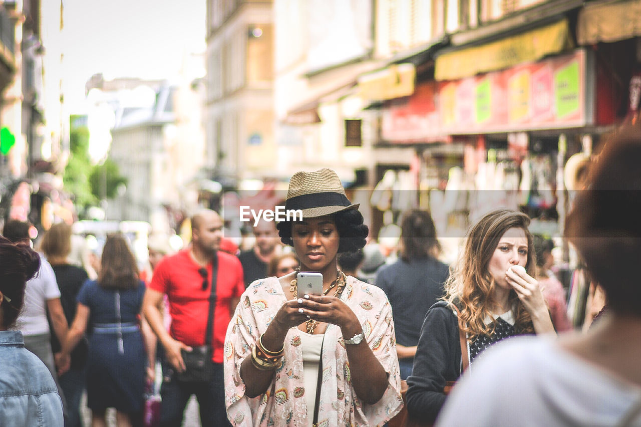 GROUP OF PEOPLE IN STREET