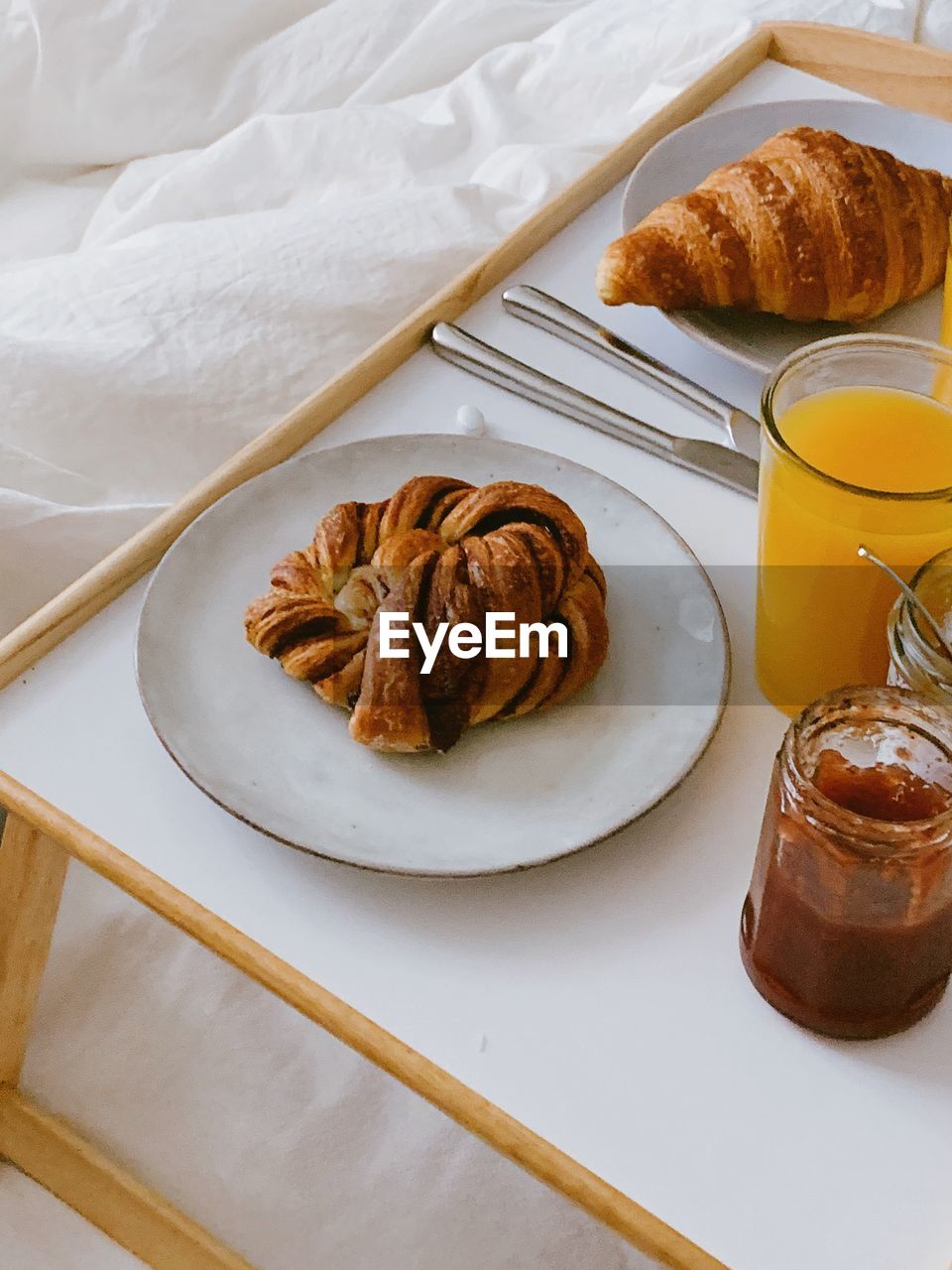 High angle view of breakfast served on table in bed