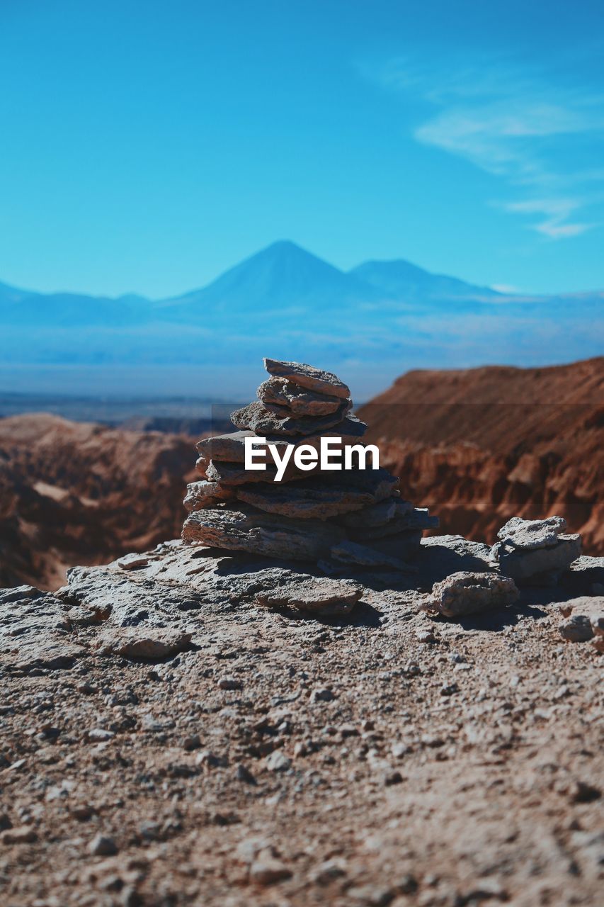 Pile of stones with mountain in background