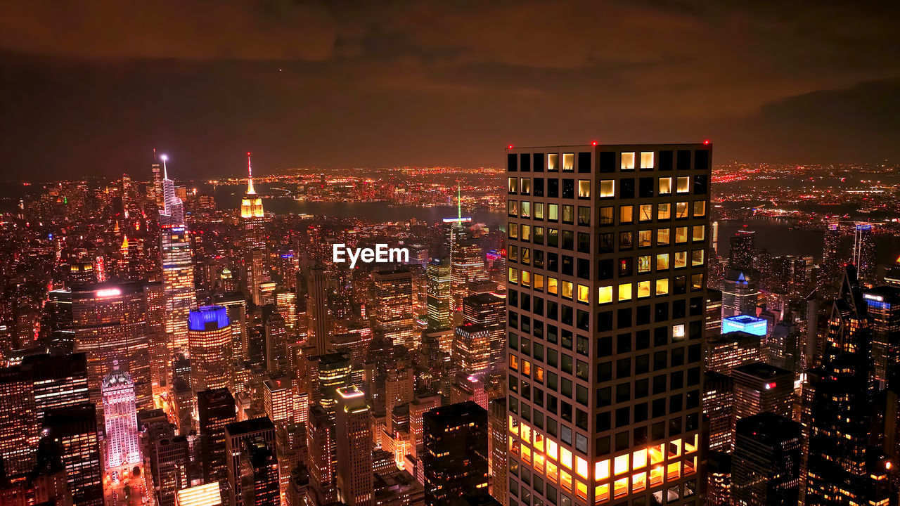 Illuminated buildings in city at night,ny,usa