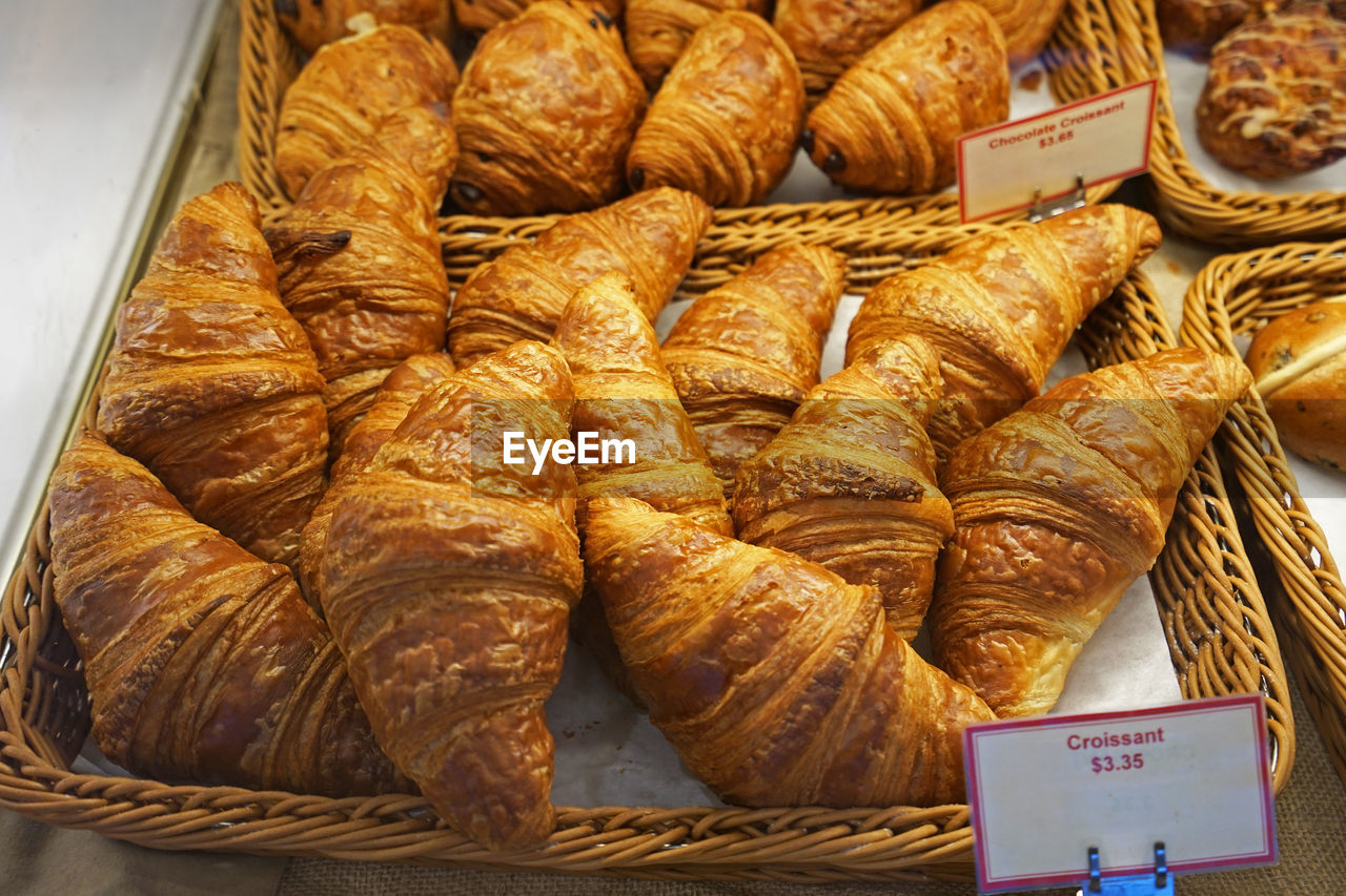 Close up display shelf of plain butter croissants