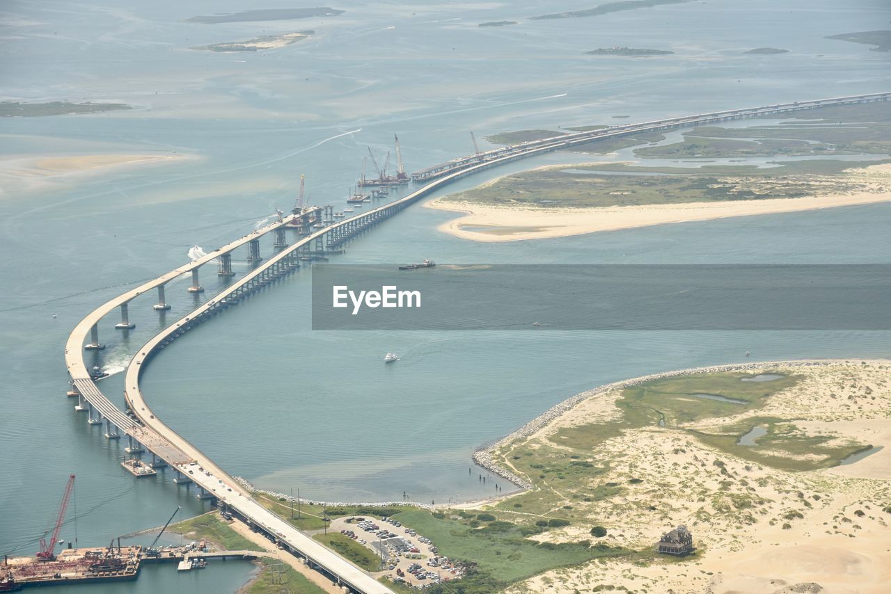 HIGH ANGLE VIEW OF BRIDGE OVER BAY