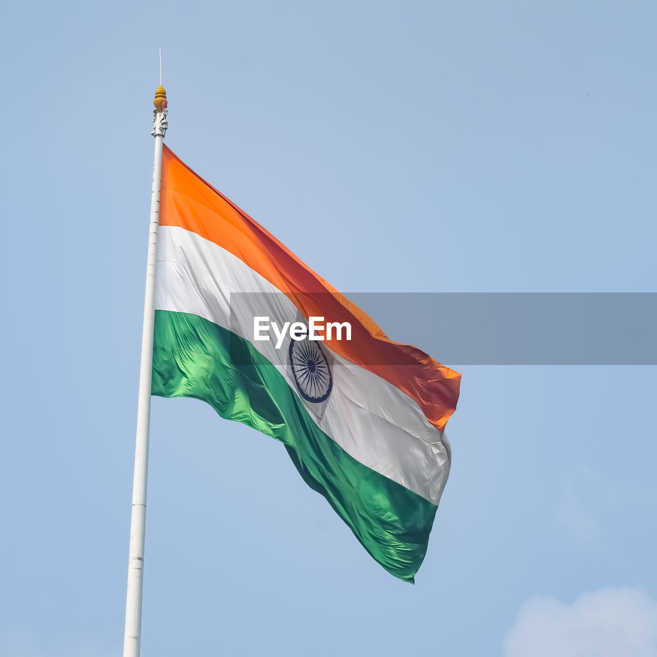 India flag flying high at connaught place with pride in blue sky, india flag fluttering, indian flag