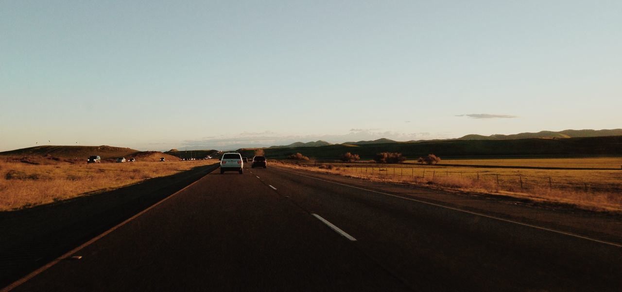 Country road against clear sky